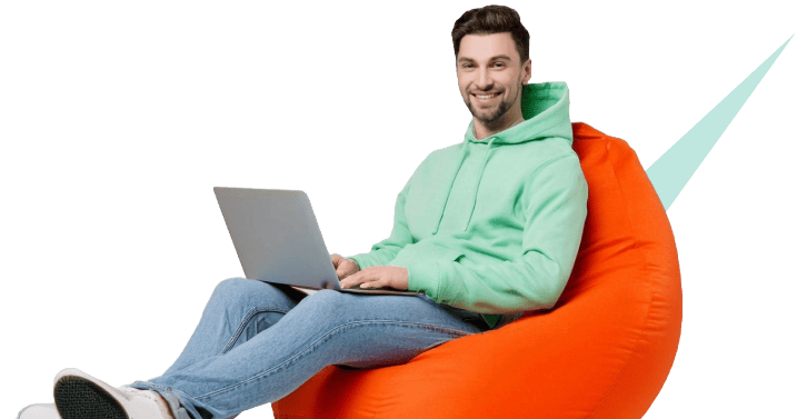 A smiling man working efficiently on a laptop, representing the ease and faster workflows achieved with the AI platform.