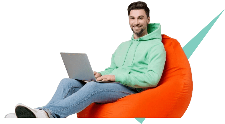 Man sitting on a beanbag with a laptop