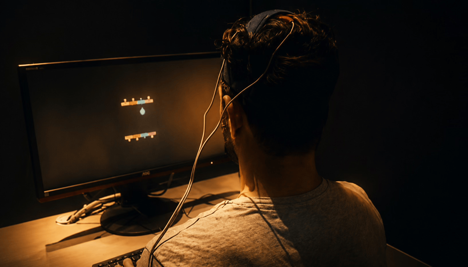Participant taking part in a psychology experiment using a computer display