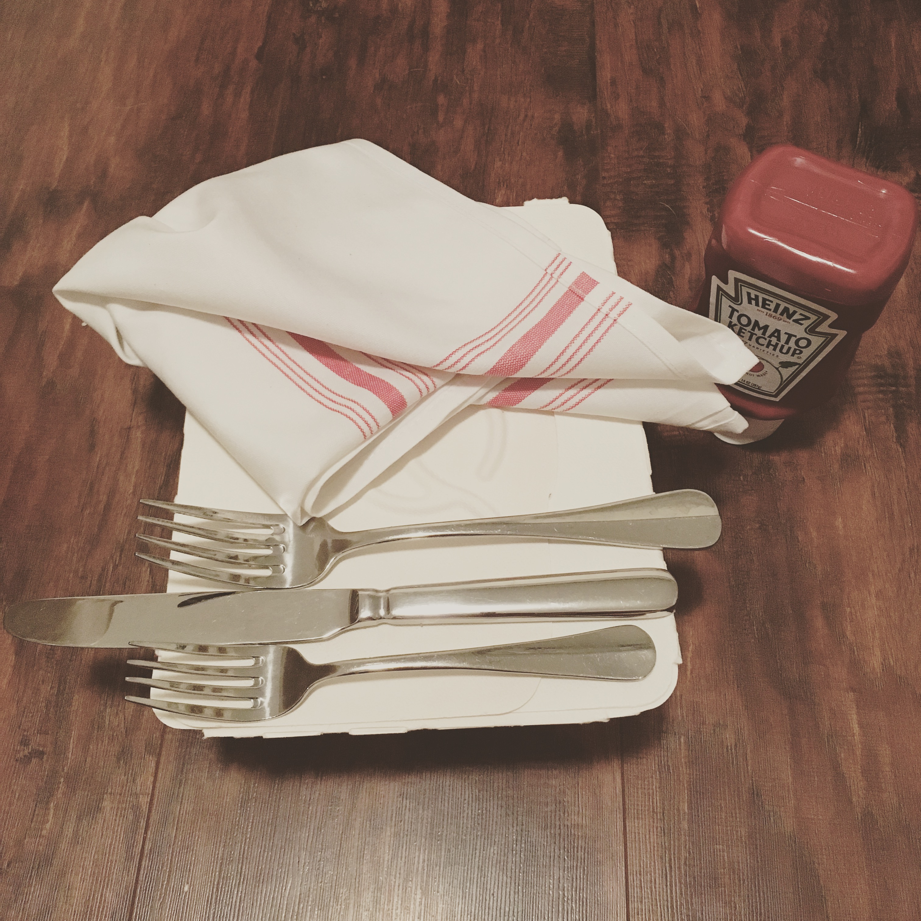 Tonight's to-go food order came with a full bottle of ketchup, real silverware, and a linen napkin. I kind of, I kind of want to drive it back to them...? July 20