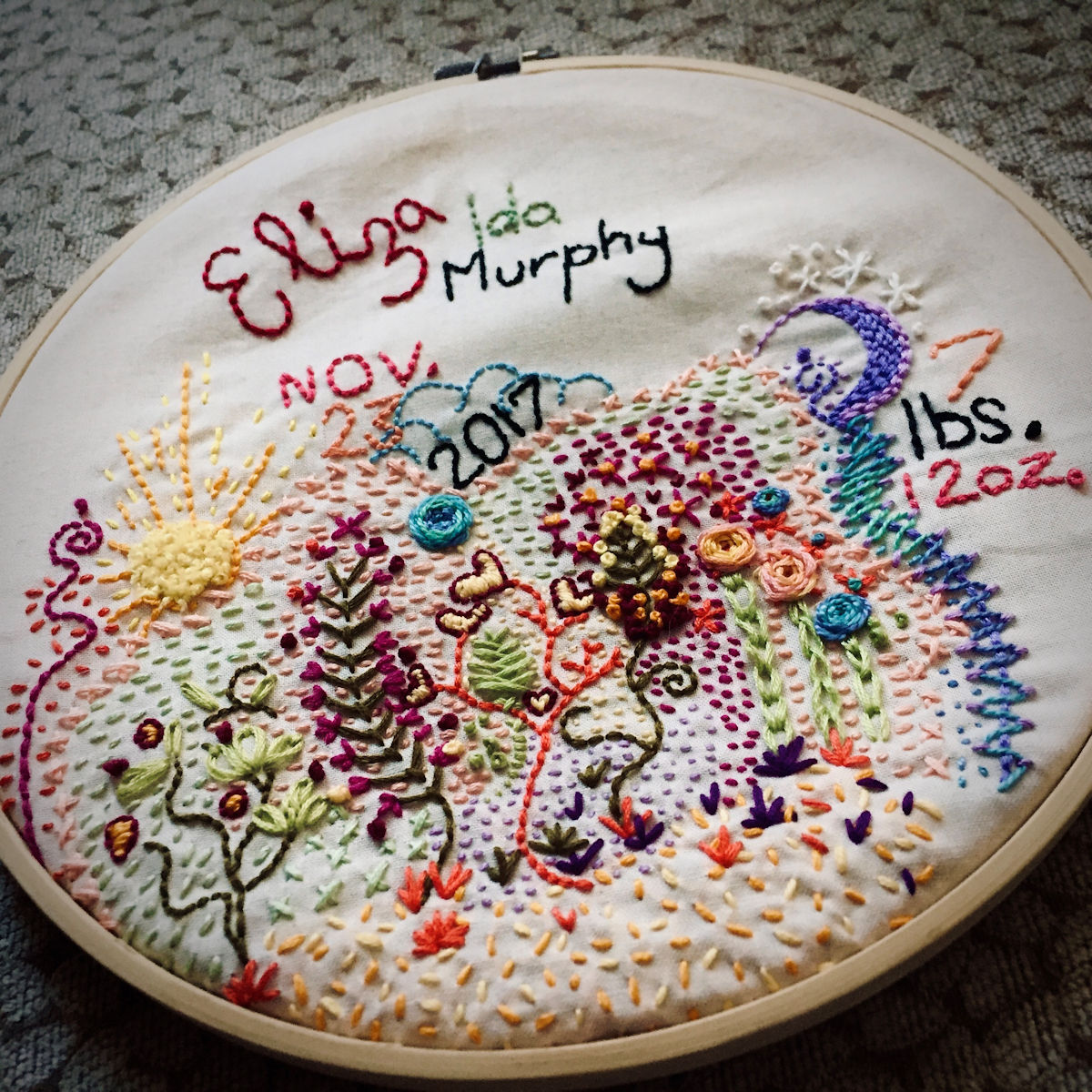 “Our Sun and Moon” This gifted piece is a modern take on traditional embroidered birth announcements.