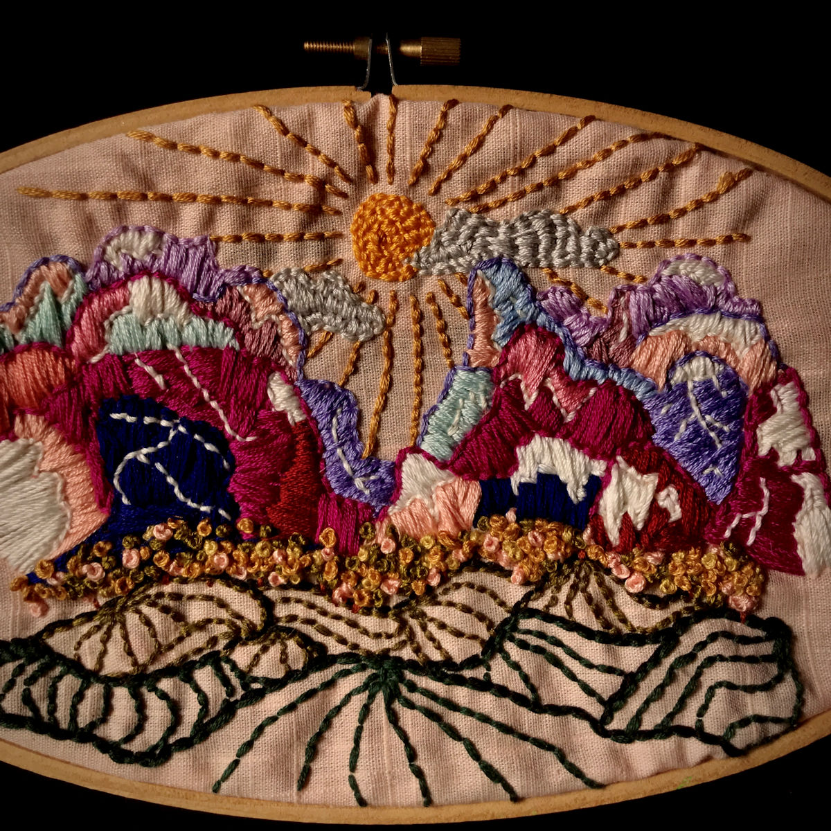 “Mountain Top” the mountains look thick thanks to the close together satin stitch.