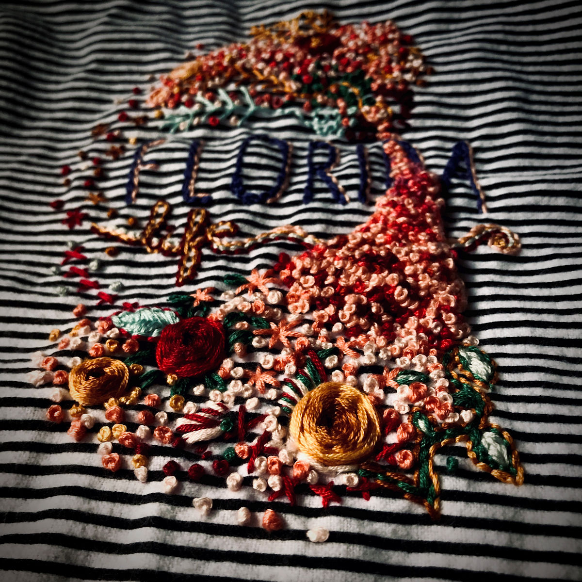 “Florida Life” a series of French Knots (also called Marriage Knots) bring texture to the flower bed.