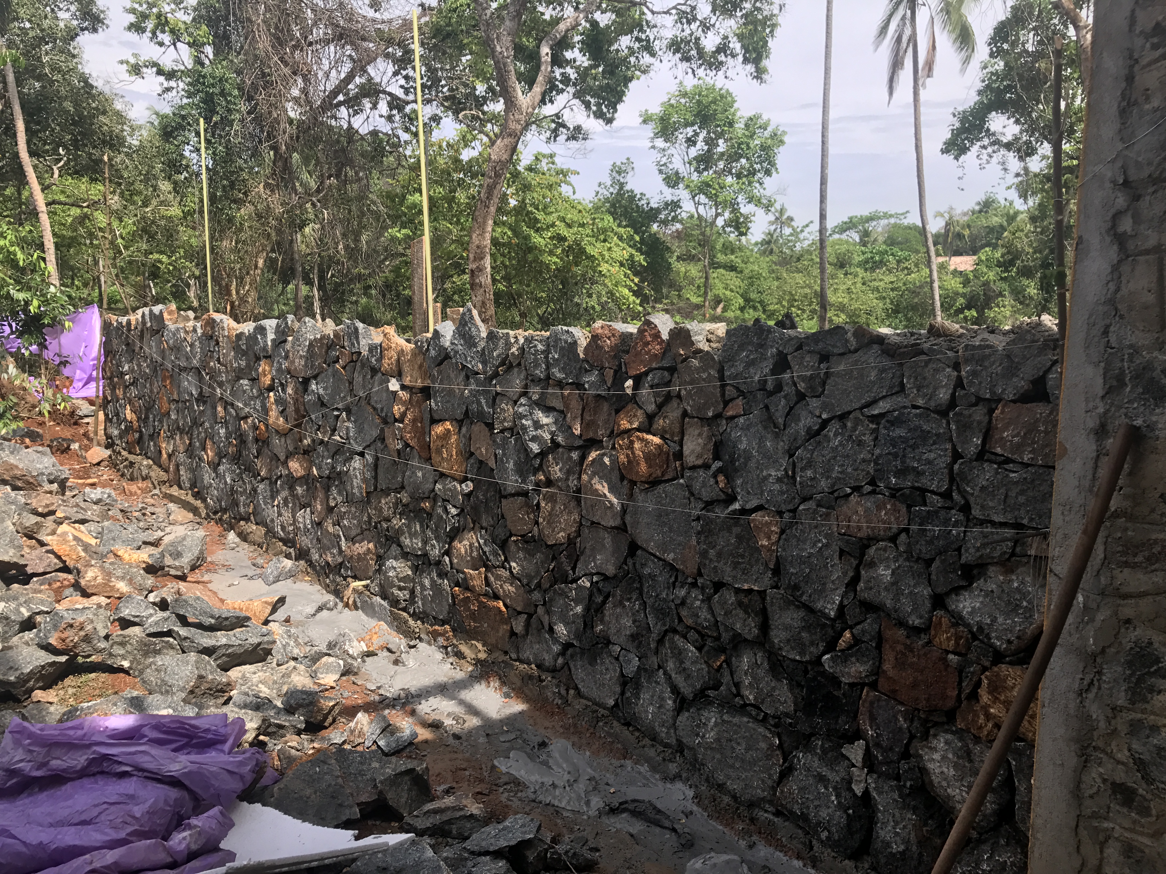 New wall being built with our rocks