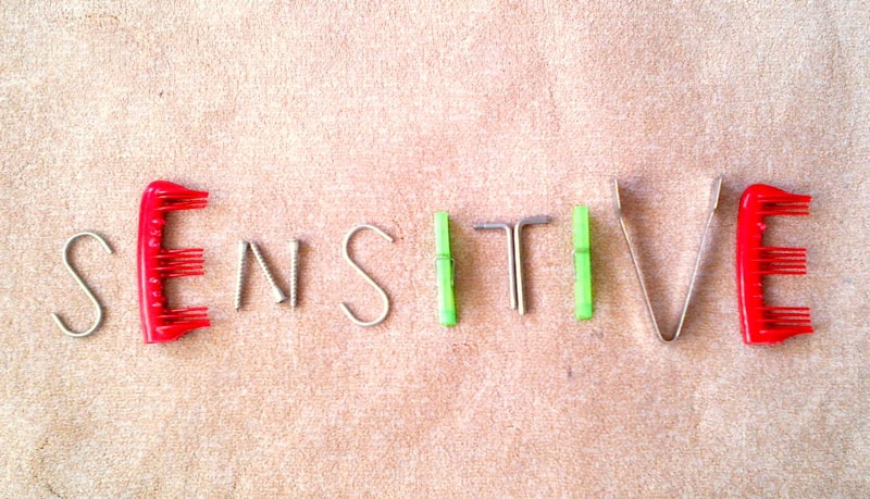 The word 'SENSITIVE' formed with various objects, symbolizing the U.S. designating South Korea as a sensitive country.