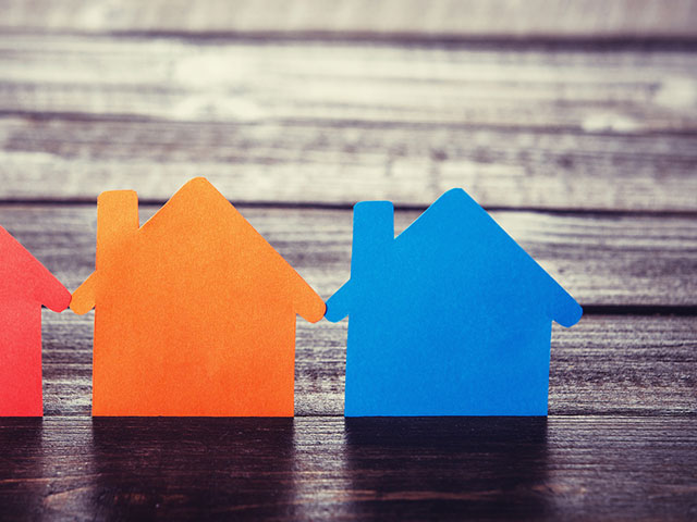 bigstock-Three-Paper-Houses-On-Wooden-Table