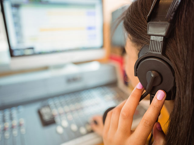 bigstock-University-student-mixing-audi