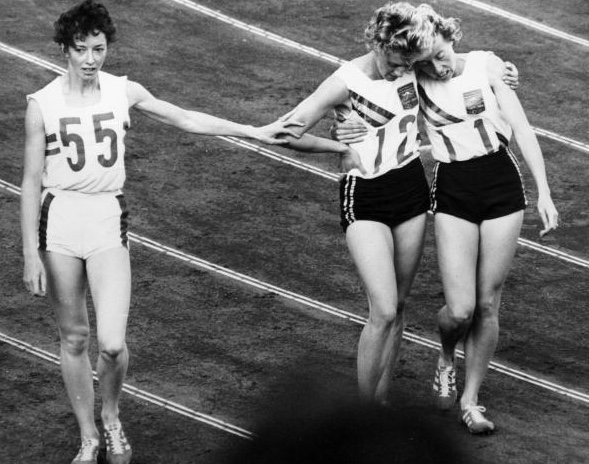 Tokyo 1964: Great Britain's Ann Packer (left) silver medallist acknowledges defeat at the hands of Australia's Betty Cuthbert (centre), winner of the 400m. Bronze medallist Judith Amooreis on the right.