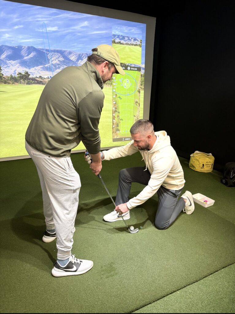 Mitch Tucker giving a golf lesson at Ken Schall Golf Performance Studio