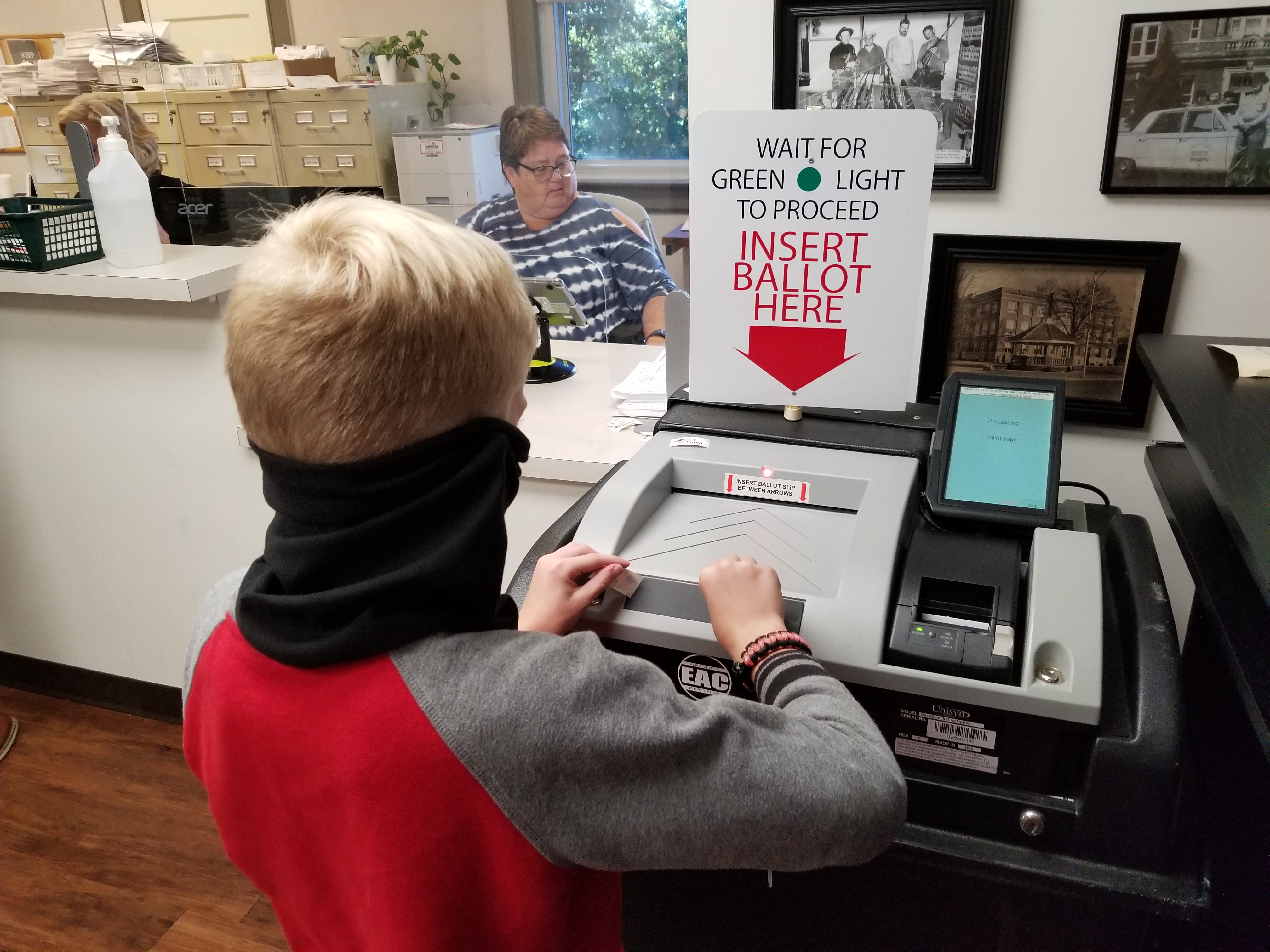 Korbin inserted our ballots for us into the machine.