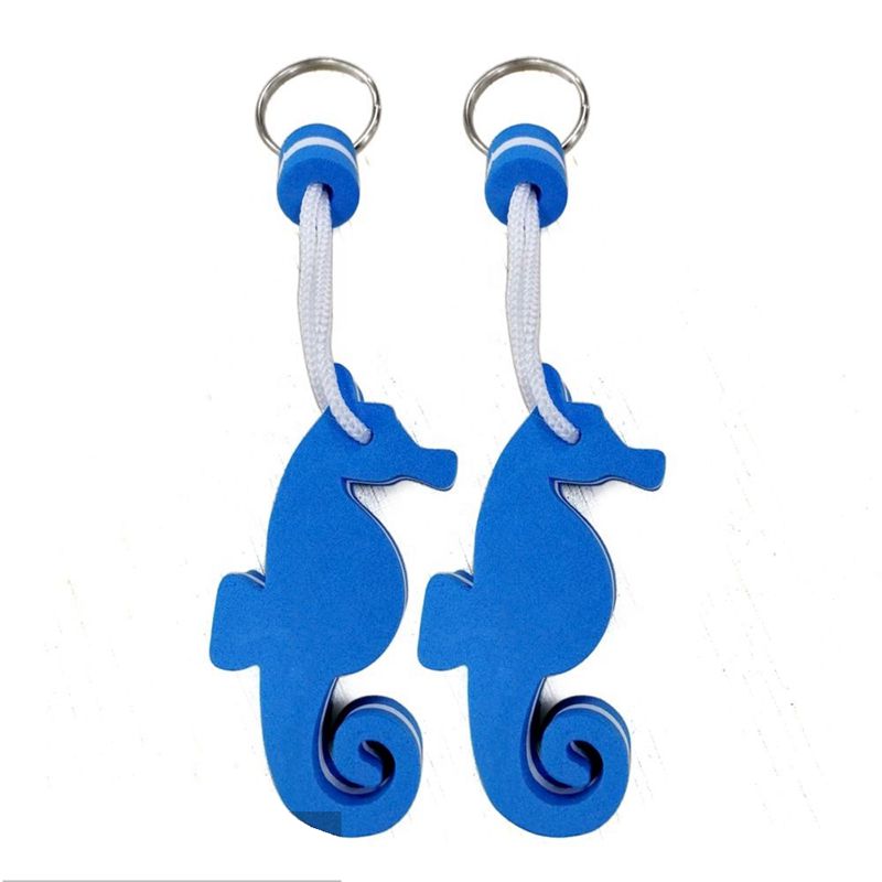A set of different colored and shaped EVA foam floating keychains, including a red, white, and blue circular one.