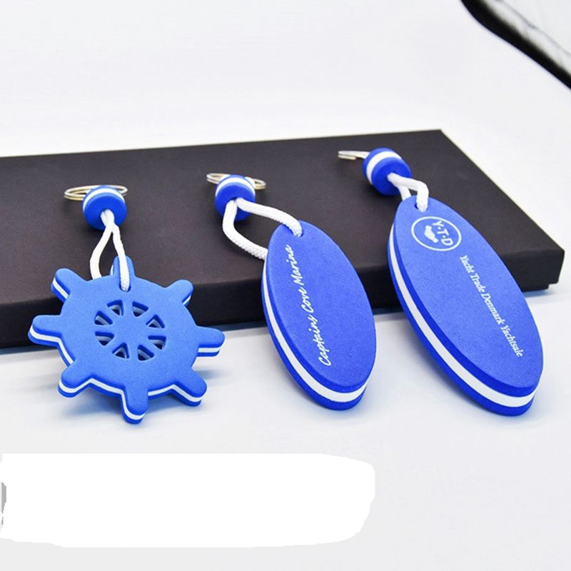 A set of different colored and shaped EVA foam floating keychains, including a red, white, and blue circular one.