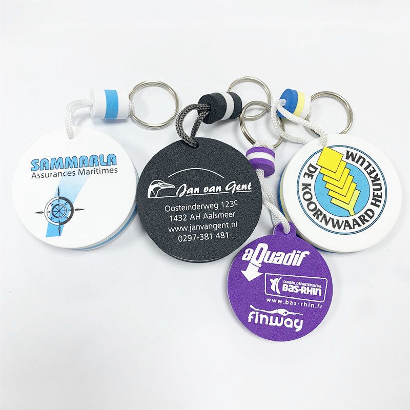 A set of different colored and shaped EVA foam floating keychains, including a red, white, and blue circular one.
