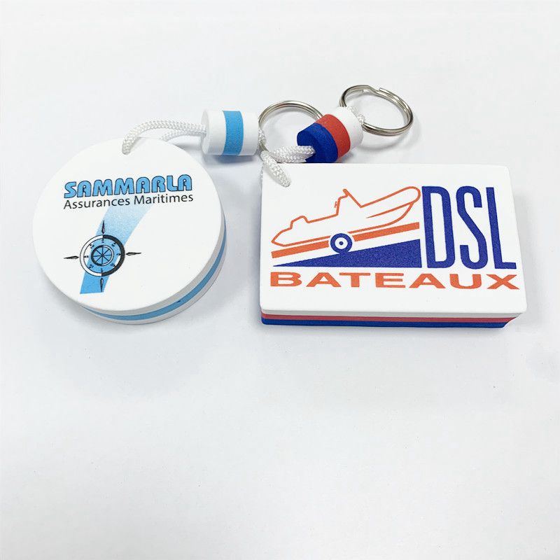 A set of different colored and shaped EVA foam floating keychains, including a red, white, and blue circular one.