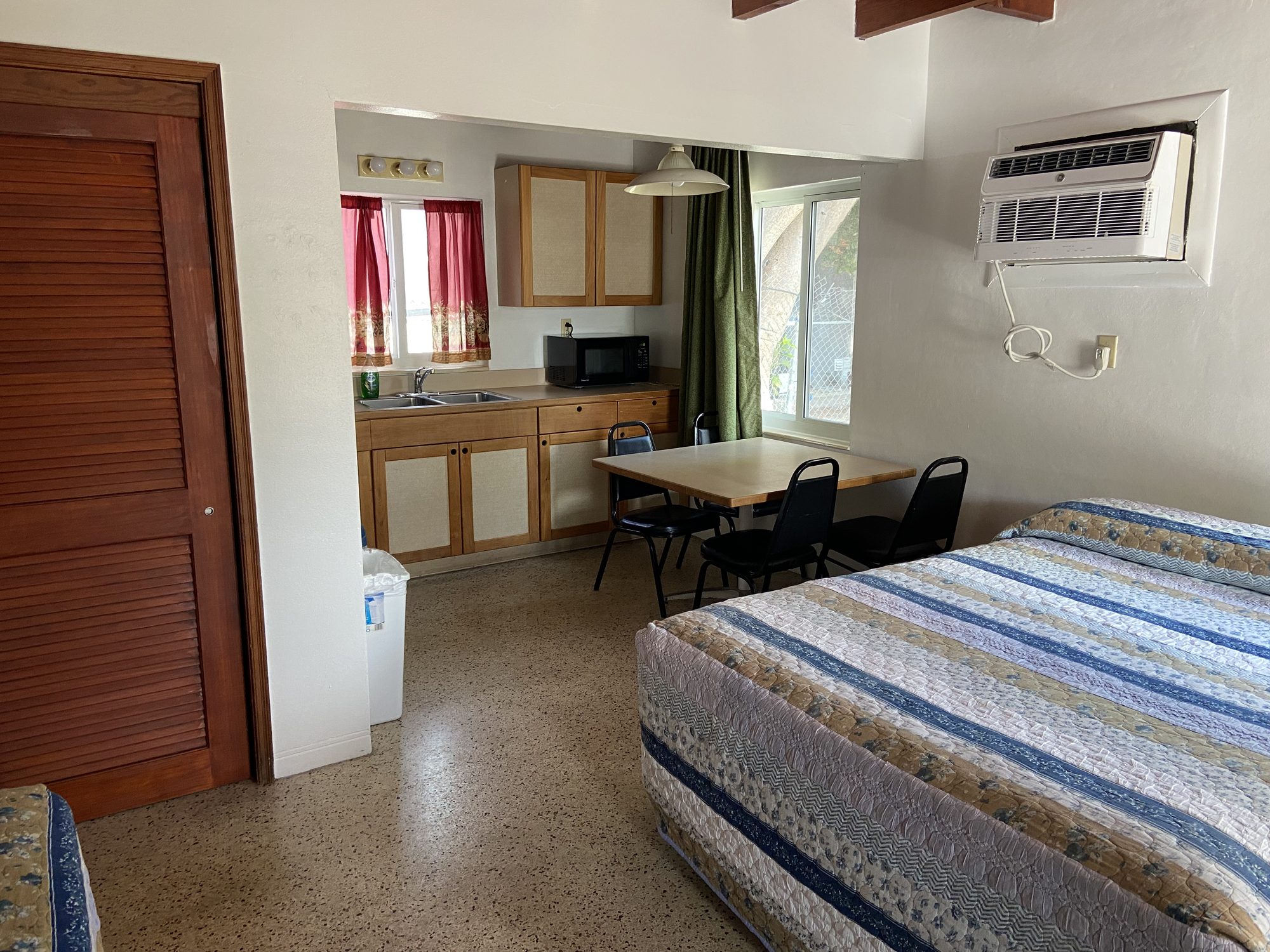 Key Lantern Motel efficiency room with kitchenette and dining table