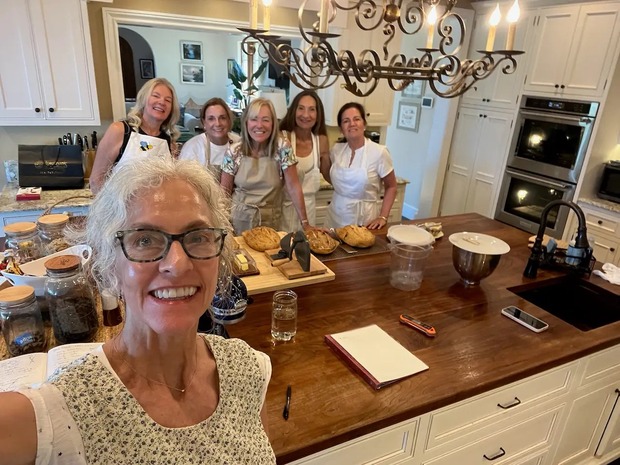 The girls before sourdough class in the kitchen, aprons on!