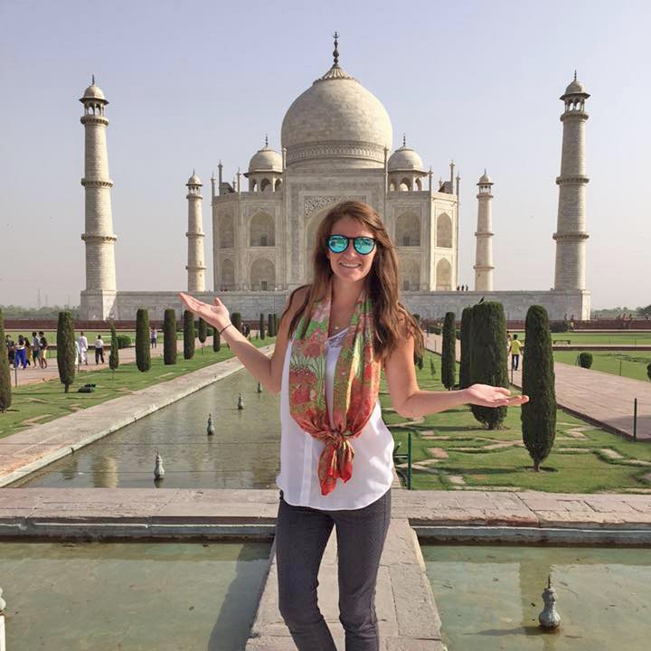 You “CAN” Buy Me Love Date Auction - A woman standing in front of Taj Mahal - Can't Buy Me Love