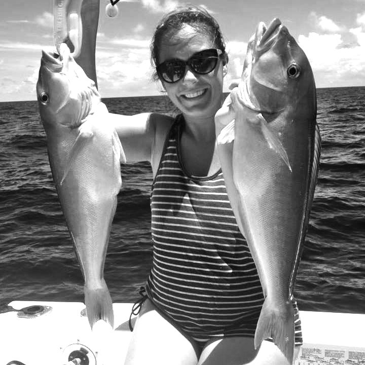 You “CAN” Buy Me Love Date Auction - A person holding a fish in the water - Florida Keys
