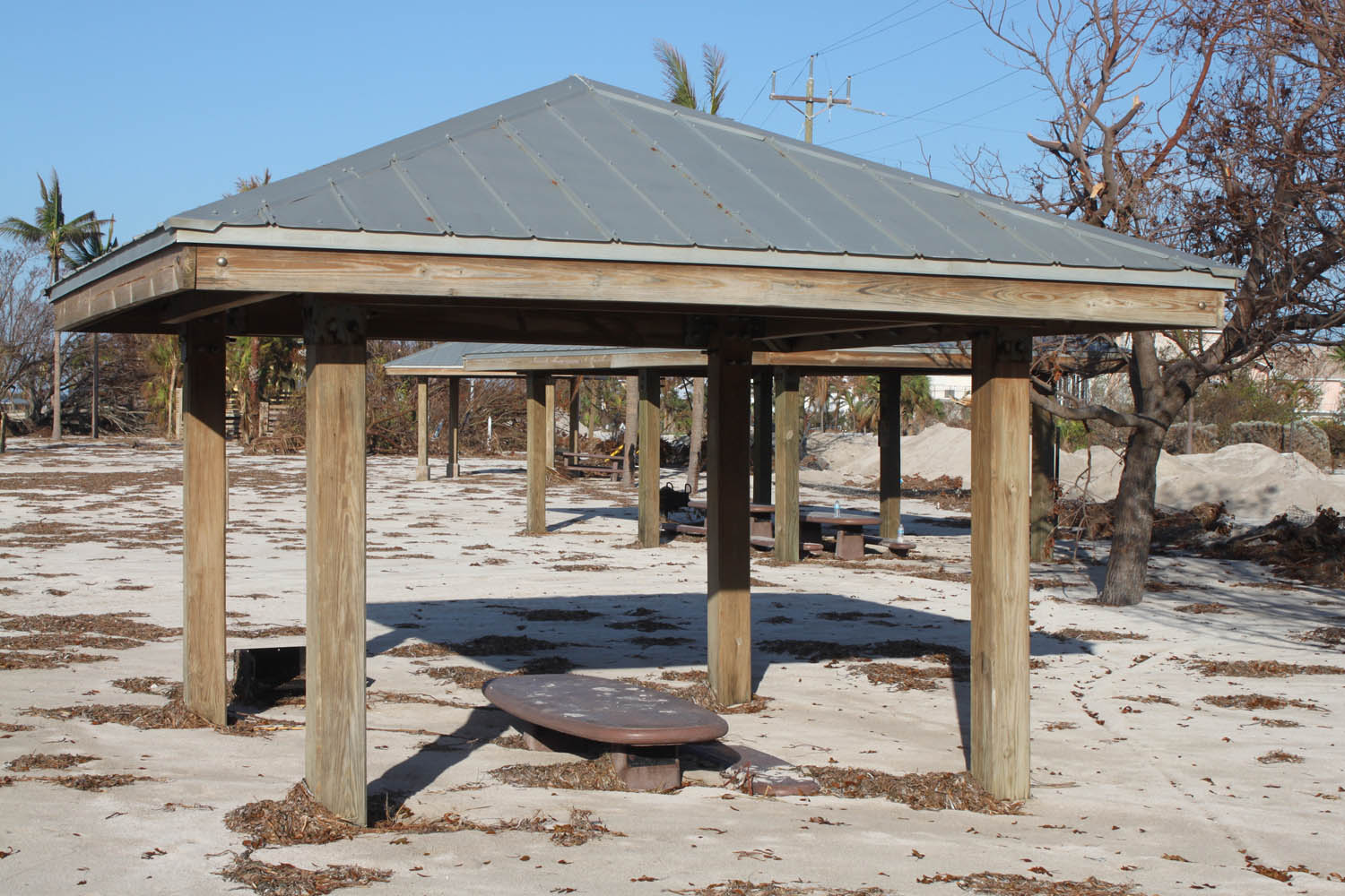 Middle Keys take a wallop - A wooden pier next to a beach - Florida Keys