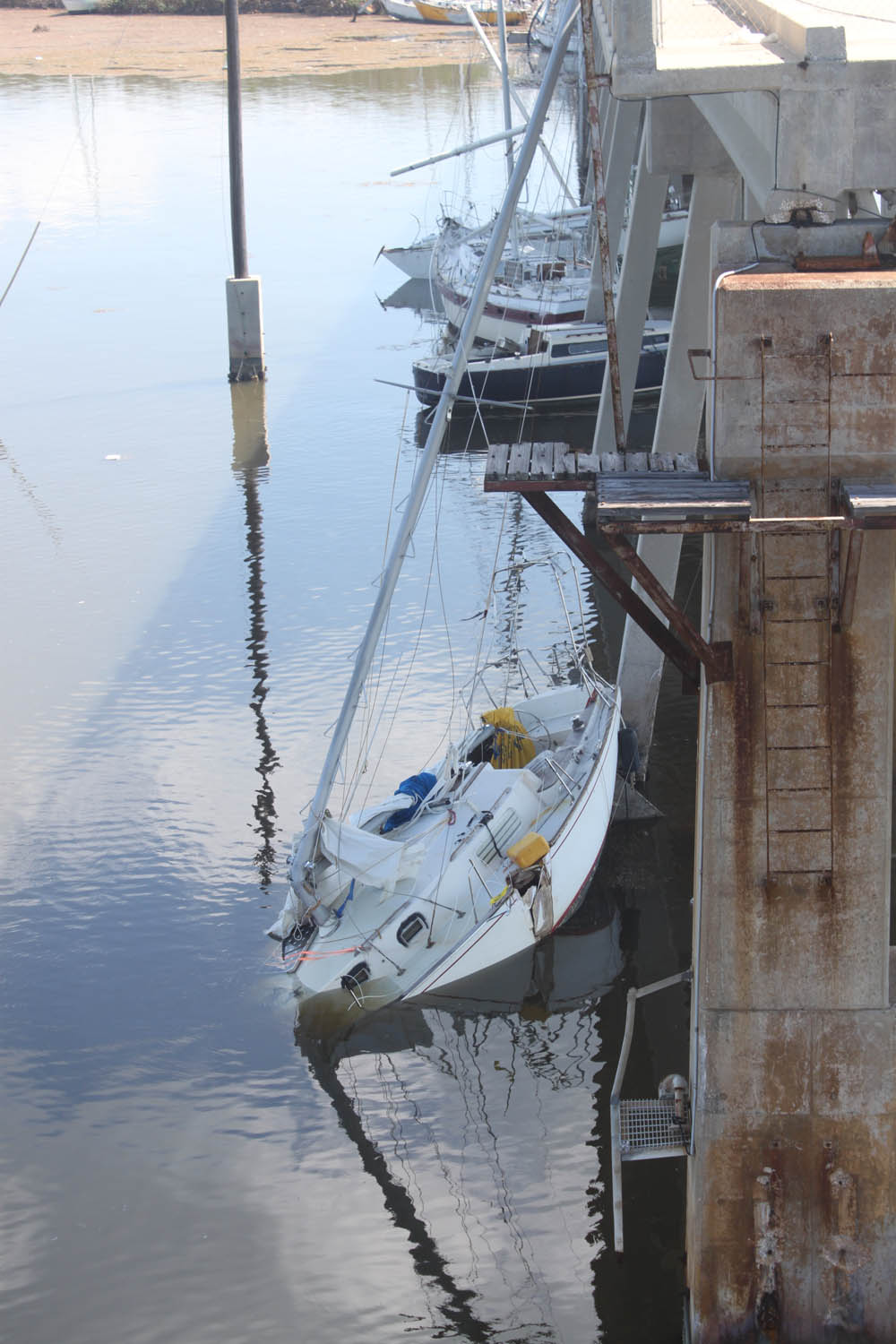 Middle Keys take a wallop - A small boat in a body of water - Tall ship