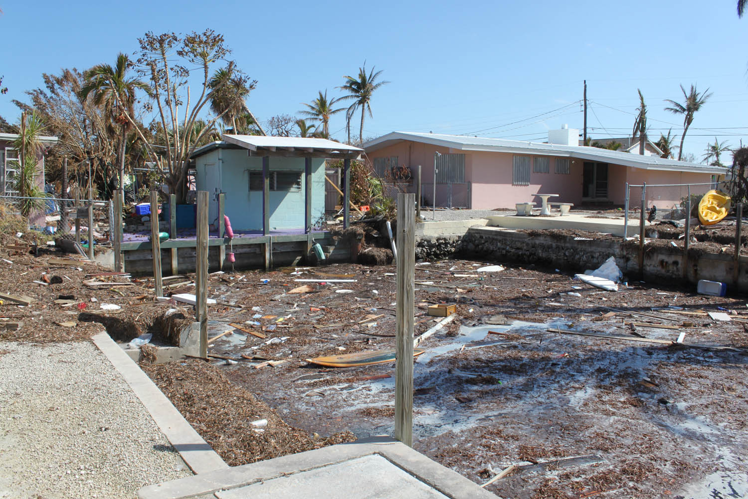 Middle Keys take a wallop - A truck driving down a dirt yard - Rowell's Waterfront Park