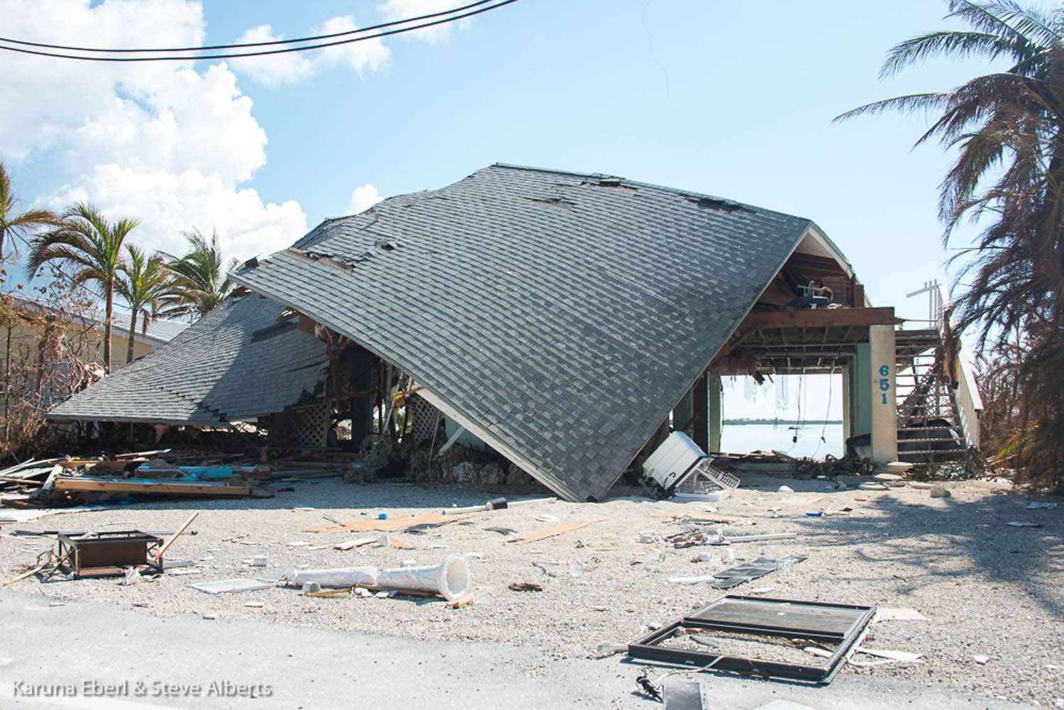 Area looks like a ‘blast zone’ - An umbrella sitting on top of a building - House