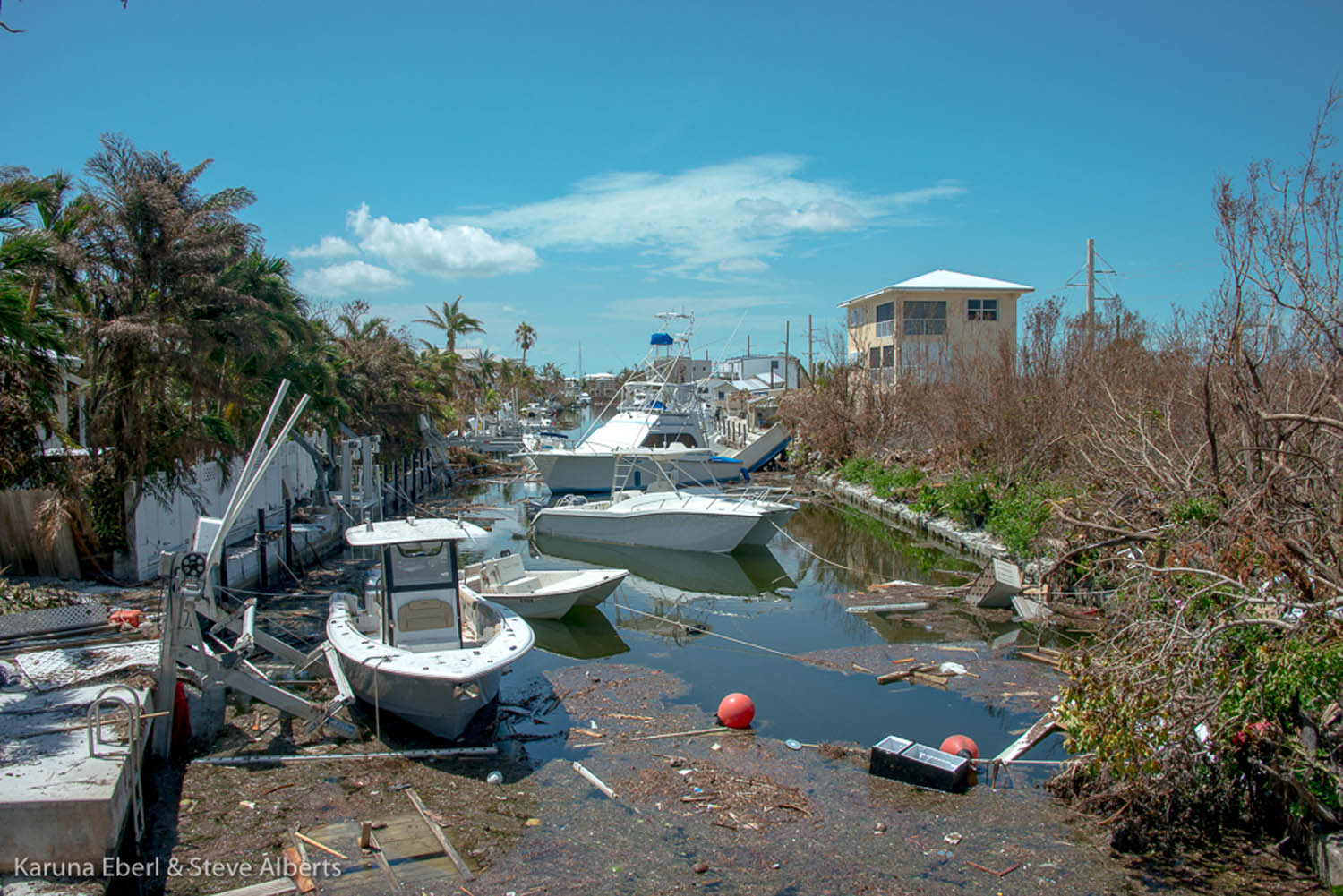 Area looks like a ‘blast zone’ - A small boat in a body of water - Summerland Key