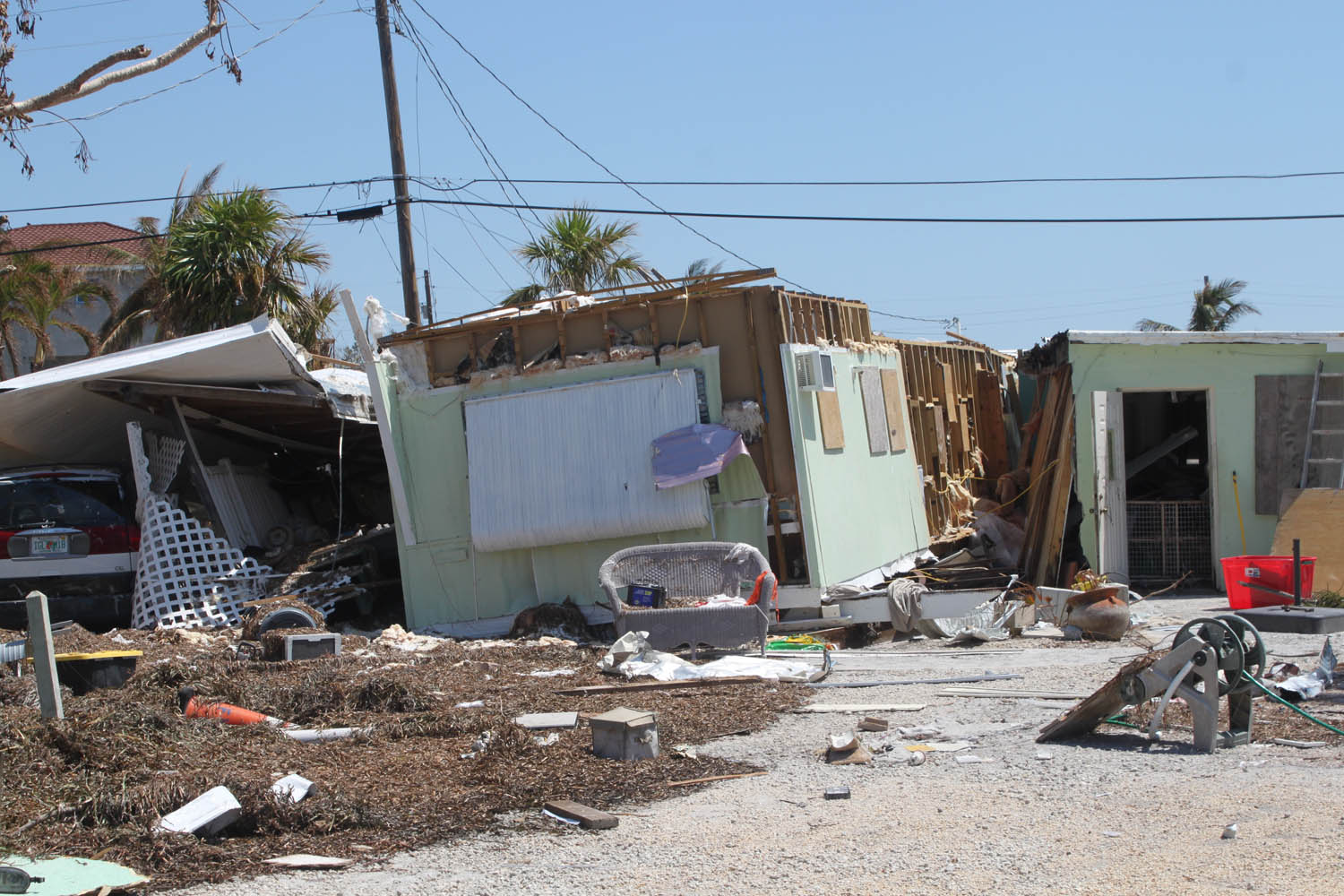 Middle Keys take a wallop - A pile of dirt in front of a house - Demolition
