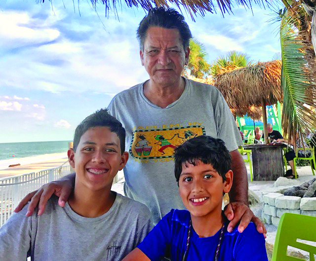 Familiar Faces of Fathers from Key West, Marathon, and the Upper Keys - A person standing in front of a group of people posing for the camera - Jim Valvano