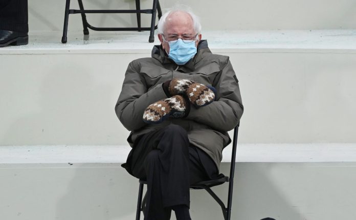 Top10 a man sitting in a chair wearing a face mask