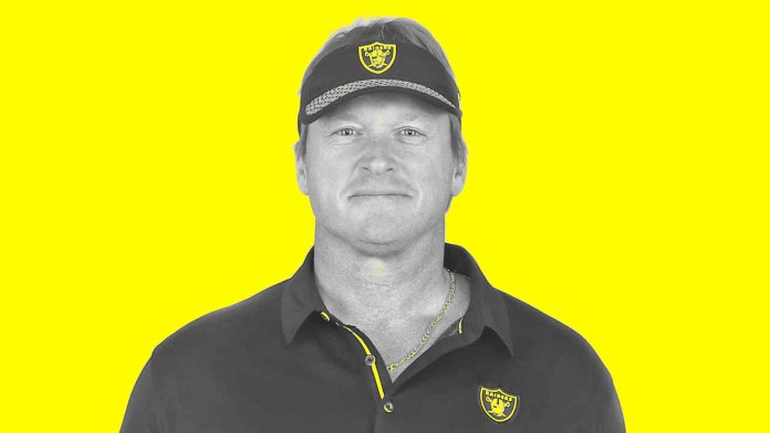 jon-gruden a man wearing a hat and a polo shirt