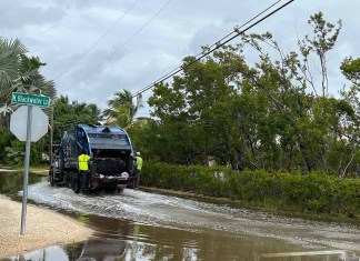 a truck is driving through a flooded street