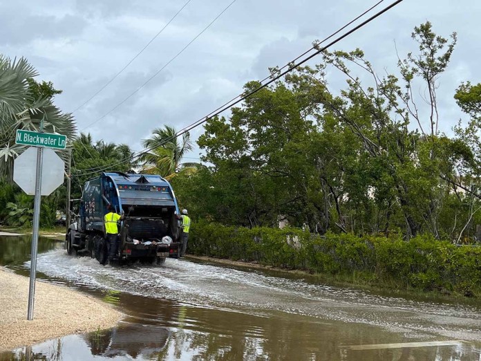Stillwright Way Nov. 11, 2021 a truck is driving through a flooded street