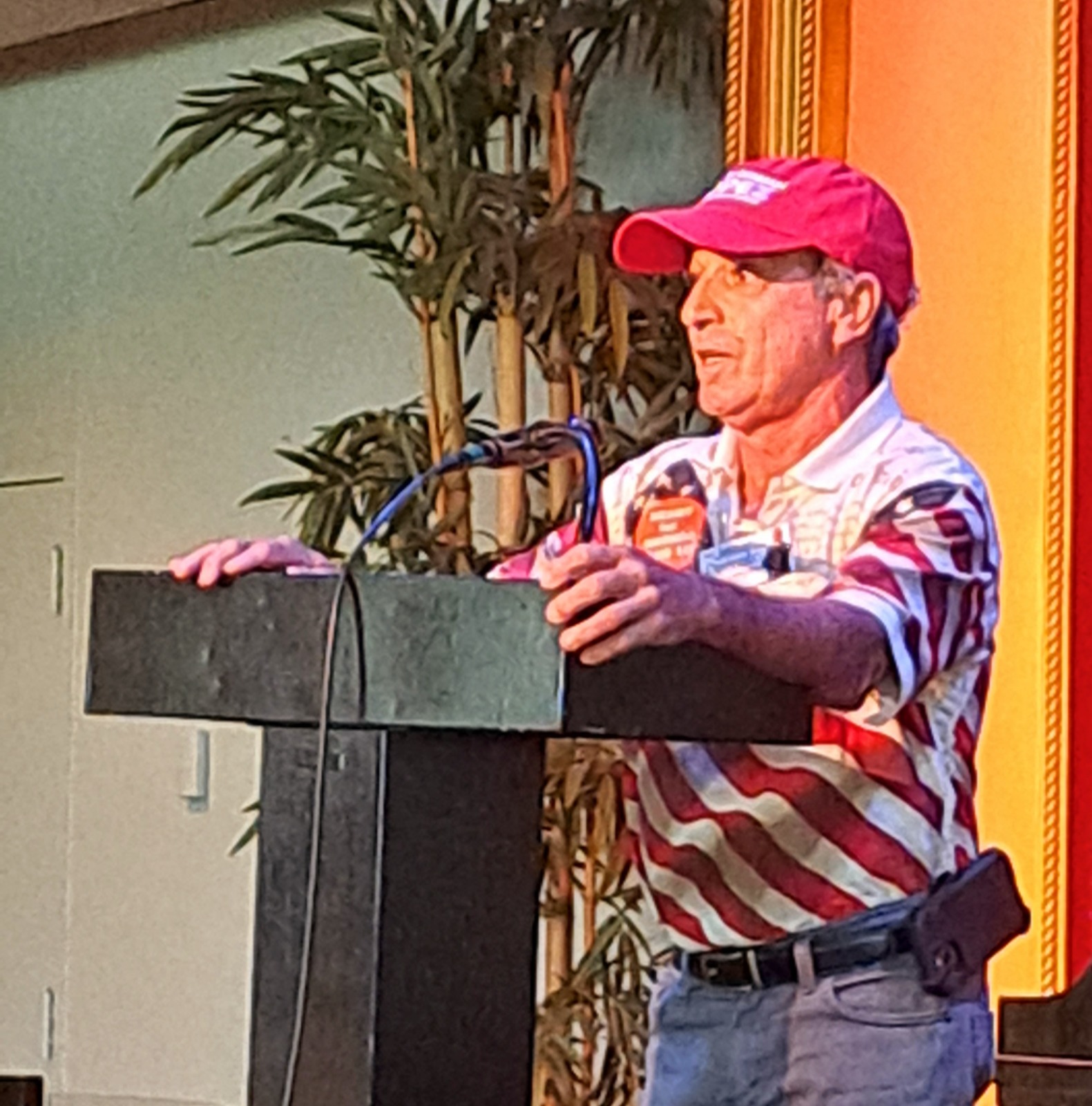 a man standing at a podium giving a speech