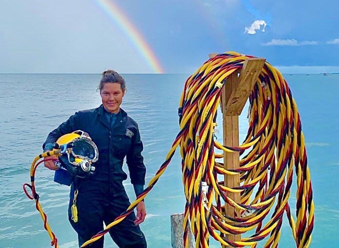 image4 Large a woman standing on a dock next to a rainbow