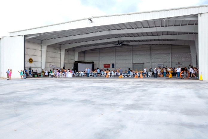 a large group of people standing in front of a building