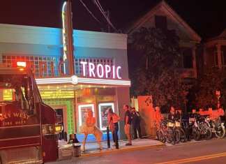 TROPIC CINEMA TO REOPEN FEB. 14 AFTER POPCORN MISHAP a fire truck parked in front of a movie theater