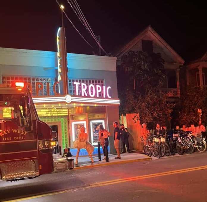 a fire truck parked in front of a movie theater