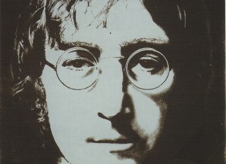 a close up of a person wearing glasses