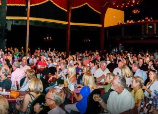 BUBBA AWARDS BRING BRAGGING RIGHTS a large group of people sitting at tables in front of a stage