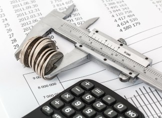MONROE COUNTY SCHOOL BOARD PASSES BUDGET a calculator, a calculator, and a calculator on