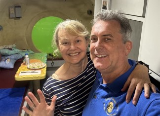 JULES’ UNDERSEA LODGE UNDERGOES MAKEOVER a man and a woman posing for a picture in a hospital room