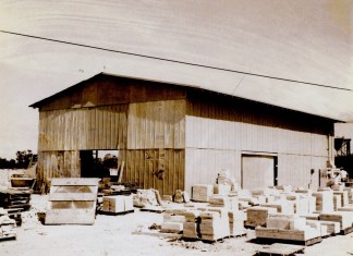 KEYS HISTORY: ONCE A THIRIVING BARRIER REEF SYSTEM, WINDLEY KEY OFFERS A GLIMPSE OF THE PAST a black and white photo of a building with boxes in front of it