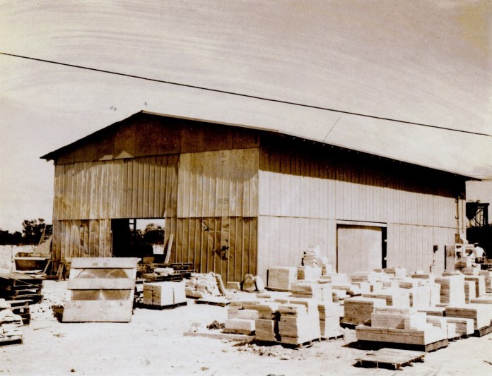 Keystone warehouse Large a black and white photo of a building with boxes in front of it