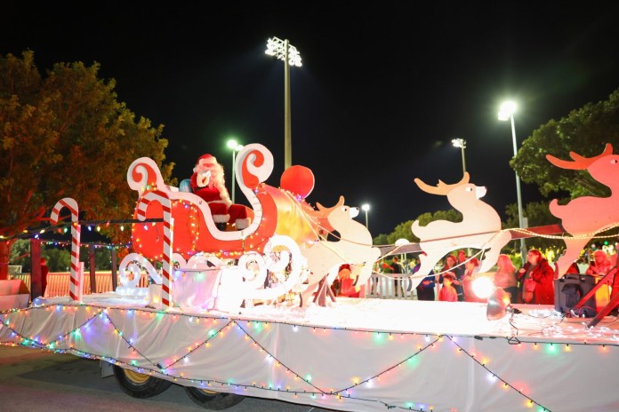 Parade a parade float decorated with christmas lights and decorations