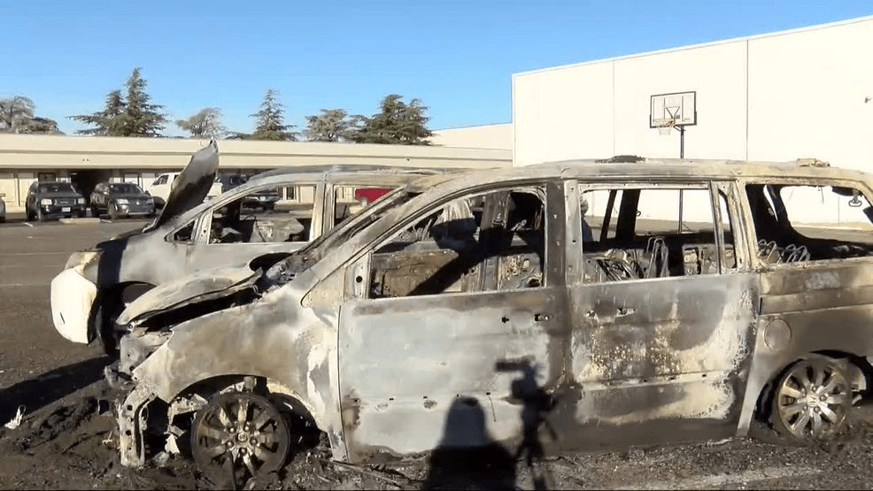 Two severely charred and burned vans outside Koinonia's Nevada Day Treatment Facility.