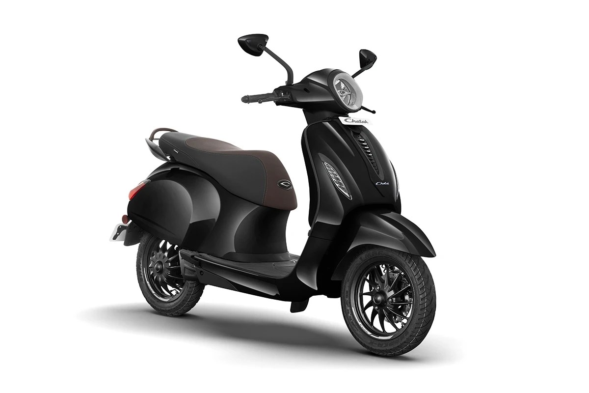 Bajaj Chetak electric scooter displayed in a studio setup, highlighting its premium finish, LED lights, and iconic design.