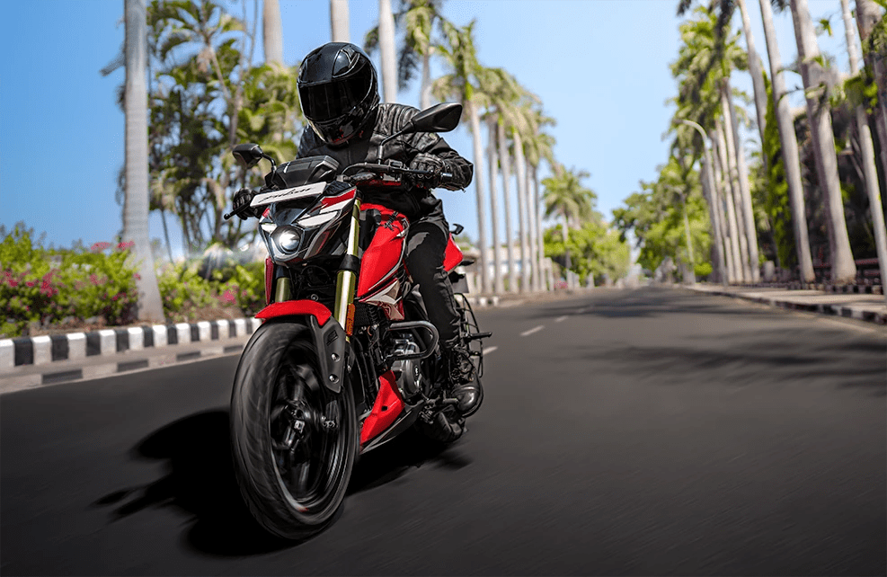 Side view of the Bajaj Pulsar NS200 under acceleration, emphasizing its sporty stance and responsive power delivery.
