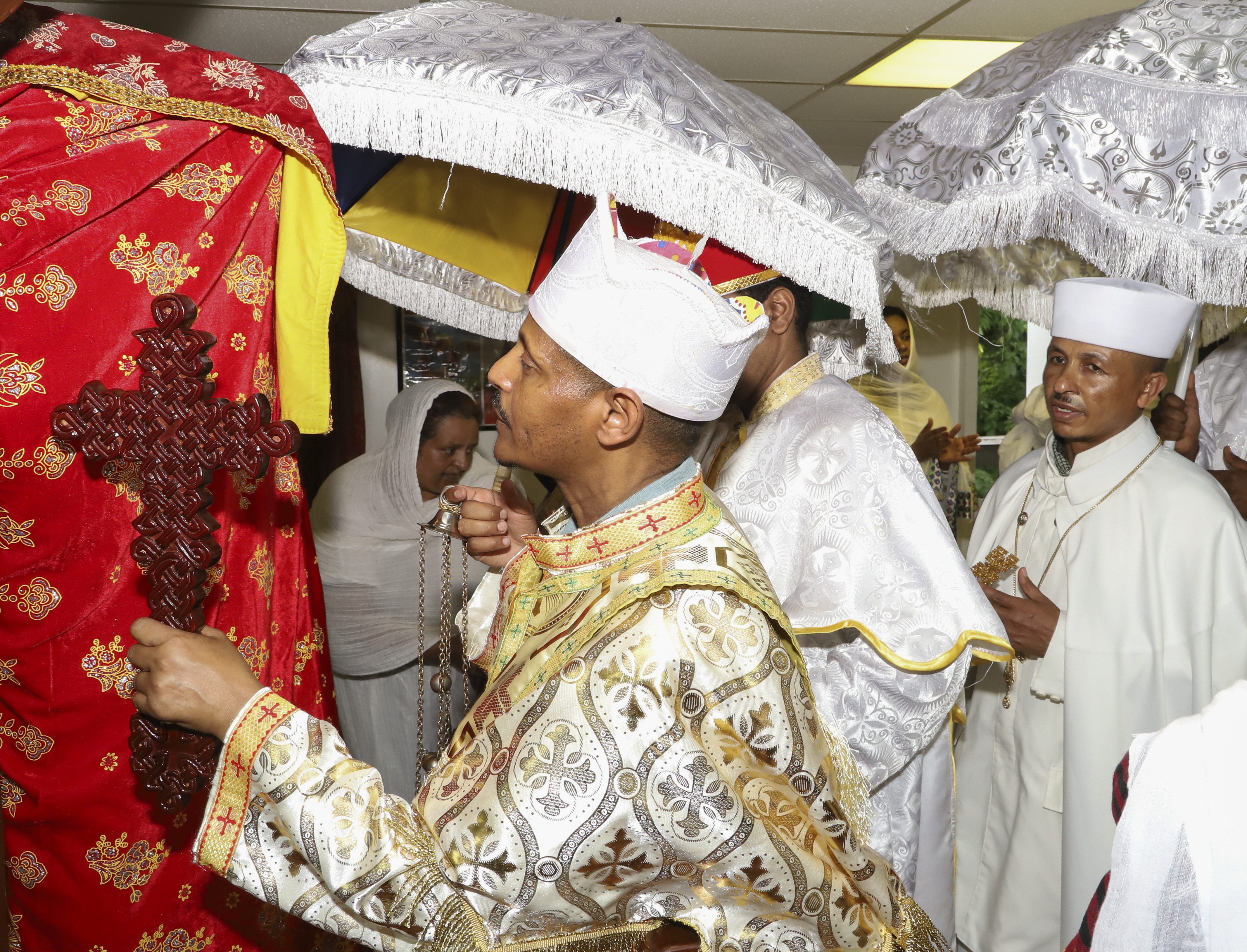 The Kidus Michael Tabot beneath ceremonial umbrellas