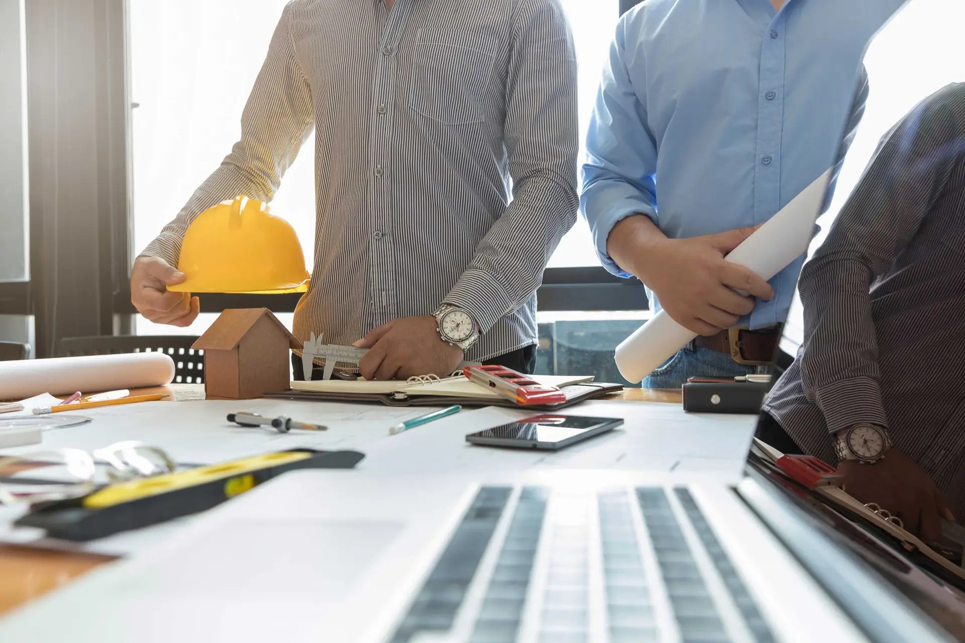 Team of top construction professionals in hard hats, showcasing expertise, teamwork, and industry leadership.